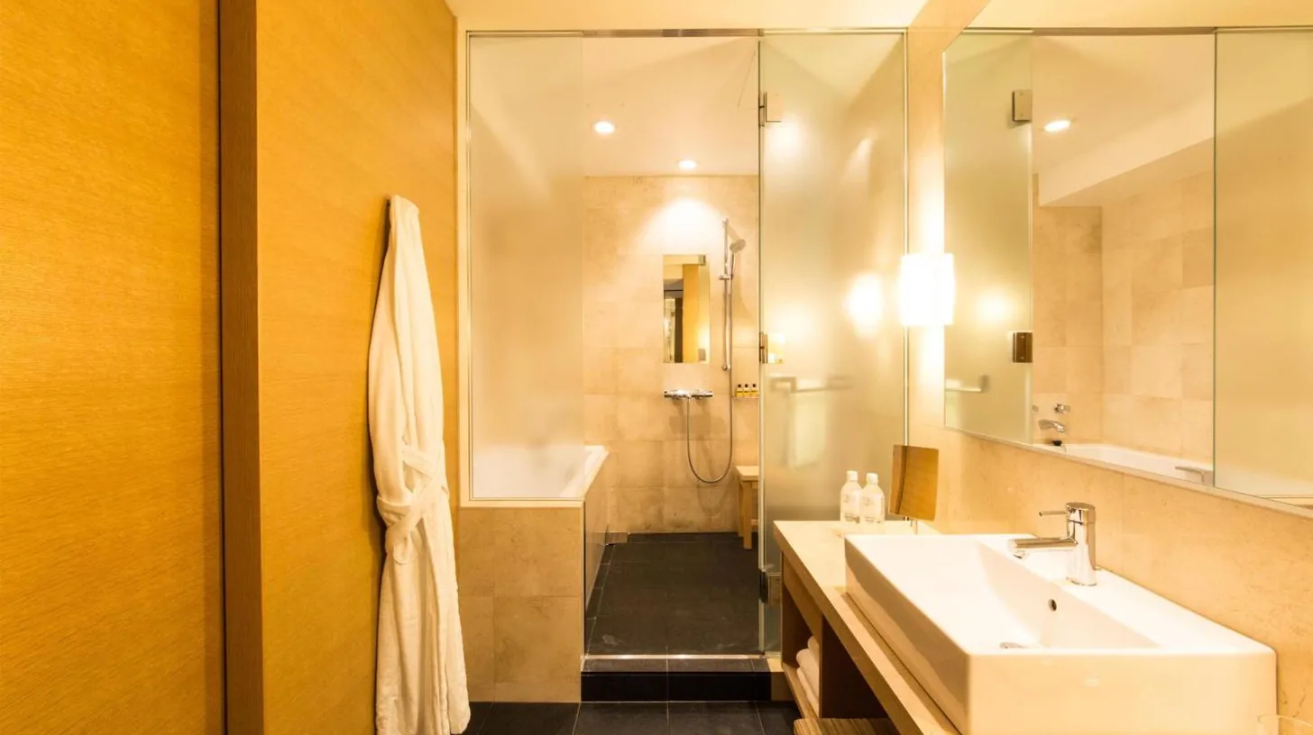 a bathroom with a sink and a mirror at Hyatt Regency Kyoto in Kyoto