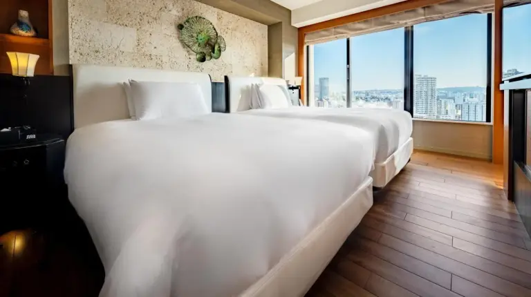 a room with a large screen television in a hotel room at Hyatt Regency Naha