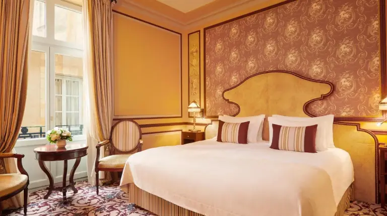a hotel room with a bed and a window at InterContinental Bordeaux Le Grand Hotel by IHG in Bordeaux