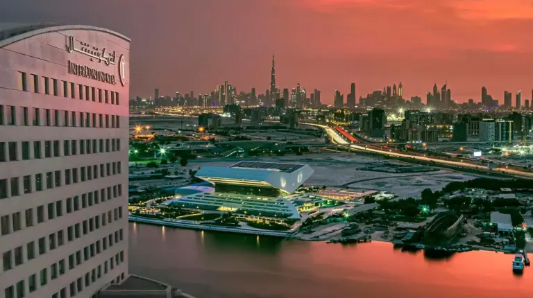 a view of a city at night with a building at InterContinental Dubai Festival City by IHG in Dubai