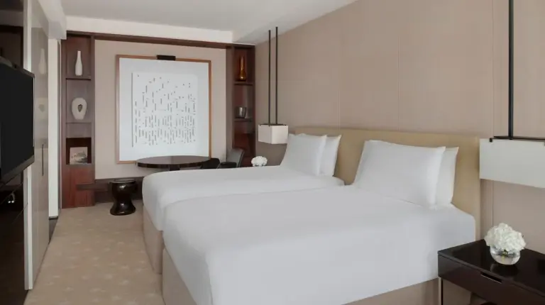 a living room with a couch and a table at InterContinental Dubai Festival City by IHG in Dubai