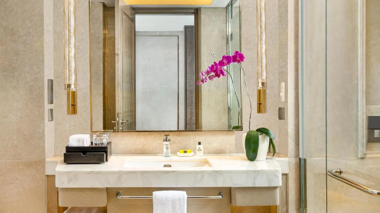 a bathroom with a sink and a mirror at InterContinental Hotels Jakarta Pondok Indah by IHG in Jakarta