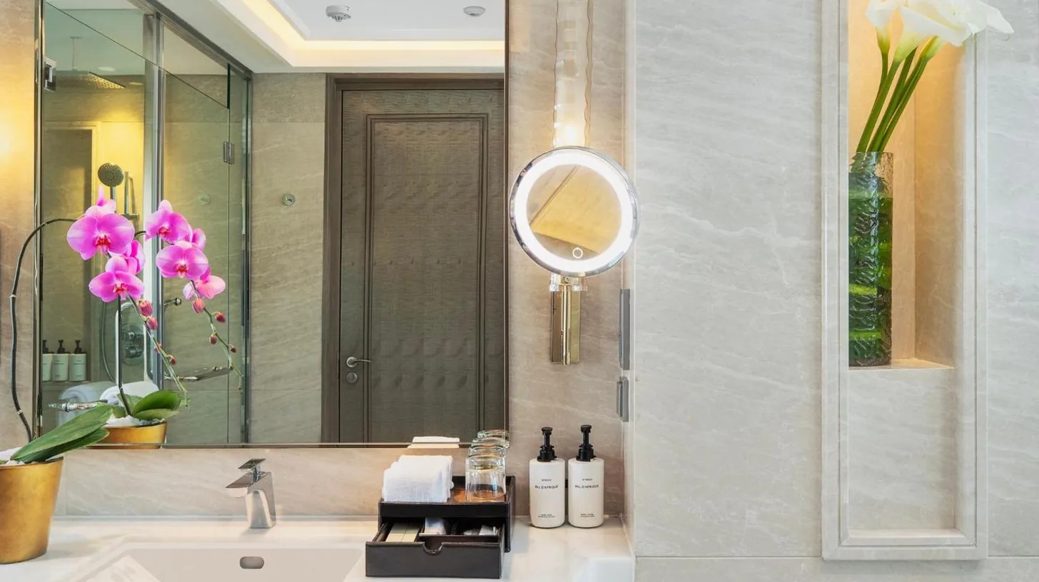 a bathroom with a tub and a sink and a toilet at InterContinental Hotels Jakarta Pondok Indah by IHG in Jakarta