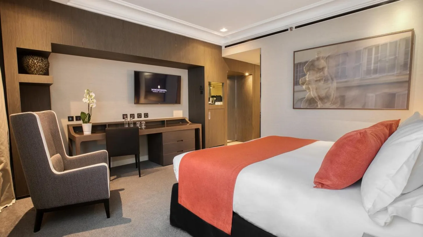 a hotel room with a bed and a desk at InterContinental Marseille - Hotel Dieu by IHG in Marseille