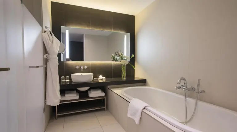 a hotel room with a bed and a couch at InterContinental Marseille - Hotel Dieu by IHG in Marseille