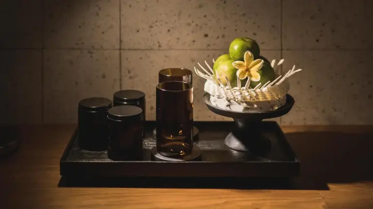 a tray with a basket of apples and glasses on a counter at iSuite by Ekosistem in Seminyak