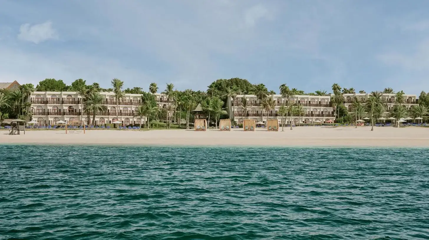 a view of the beach from the water at JA Palm Tree Court