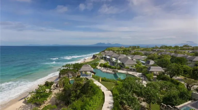 an aerial view of a resort on the beach at Jumeirah Bali in Uluwatu