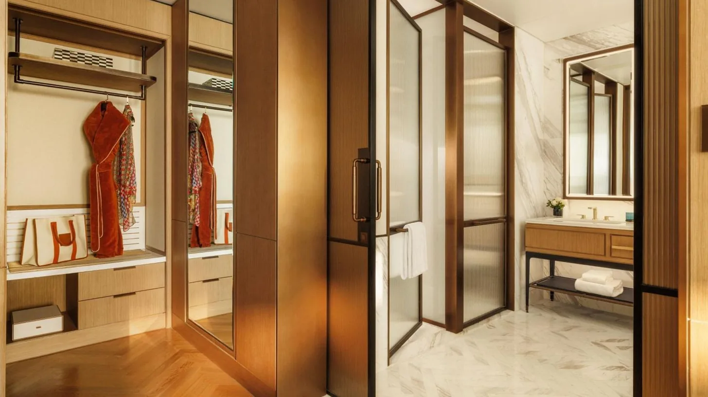 a hotel room with a bed and a balcony at Jumeirah Marsa Al Arab Dubai in Dubai