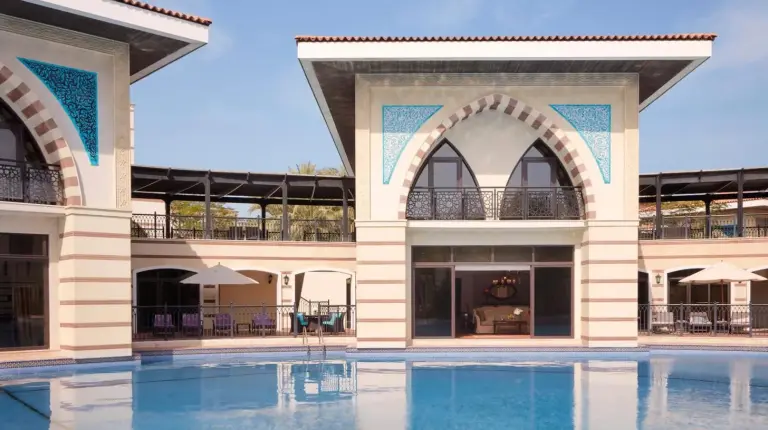 a view of a building with a swimming pool at Jumeirah Zabeel Saray Dubai in Dubai