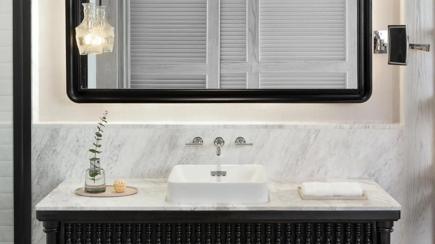 a bathroom with a sink and a mirror at Kimpton Kitalay Samui by IHG in Choeng Mon Beach