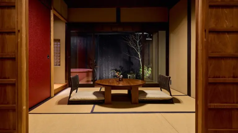 a bedroom with a bed in a room at Kyoto Machiya Fukune in Kyoto