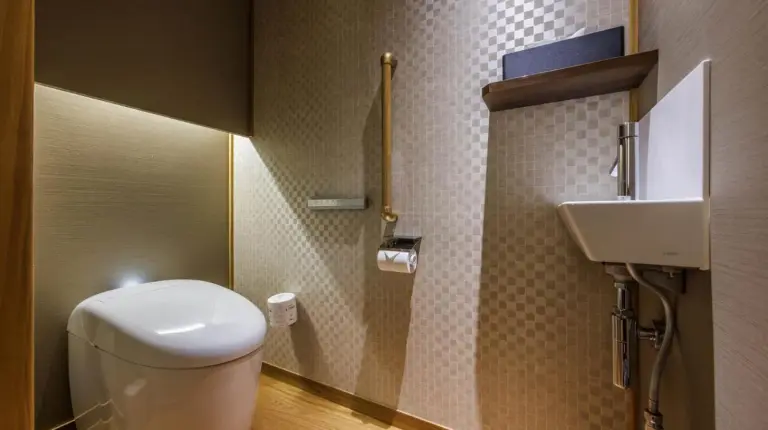 a bathroom with a toilet and a sink at Kyoto Ryokan SAKANOUE in Kyoto