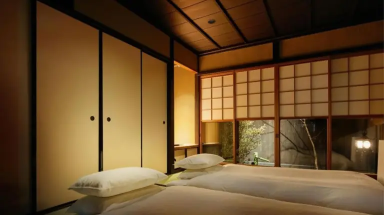 a room with a table and a large window at Kyoto Urushiro Wakasaya in Kyoto
