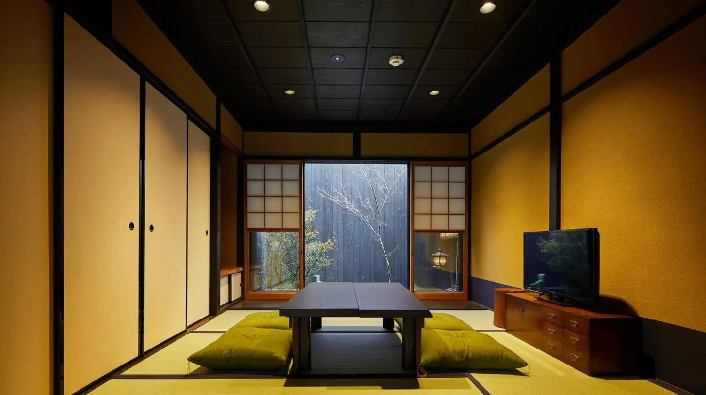 a room with a plate on a table next to a door at Kyoto Urushiro Wakasaya in Kyoto