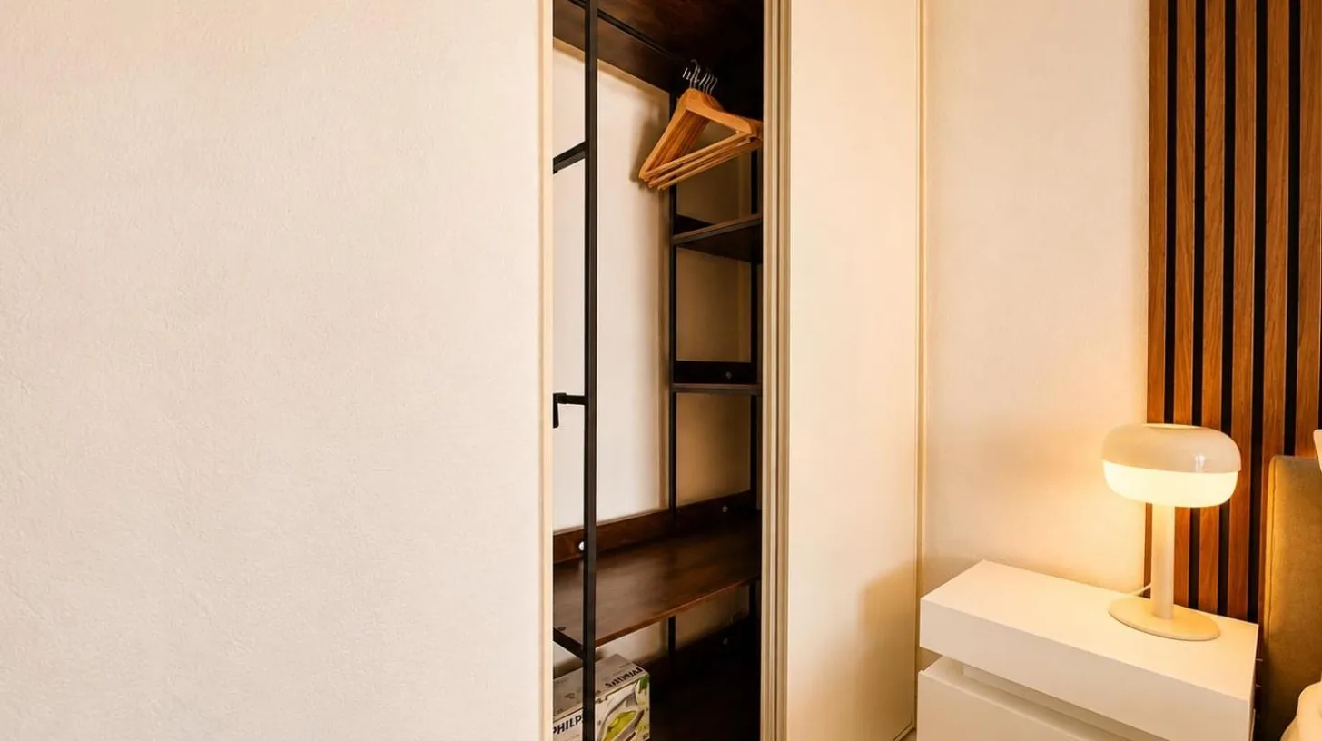 a walk in closet with a glass door at La Terrasse Bleue-Parking couvert-2 min plage-Juan Les Pins in Antibes
