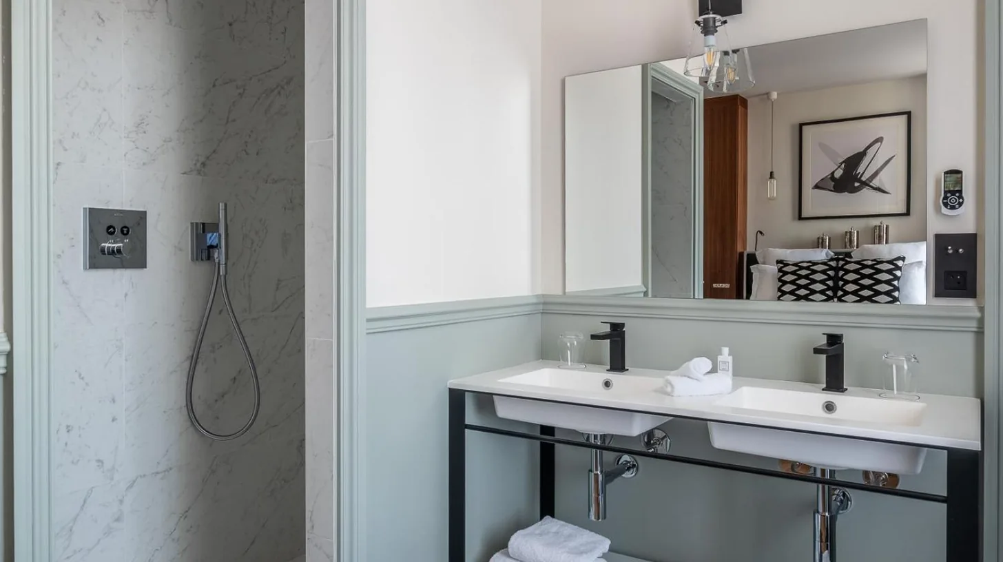 a bathroom with a sink and a mirror at Le Boutique Hotel & Spa in Bordeaux