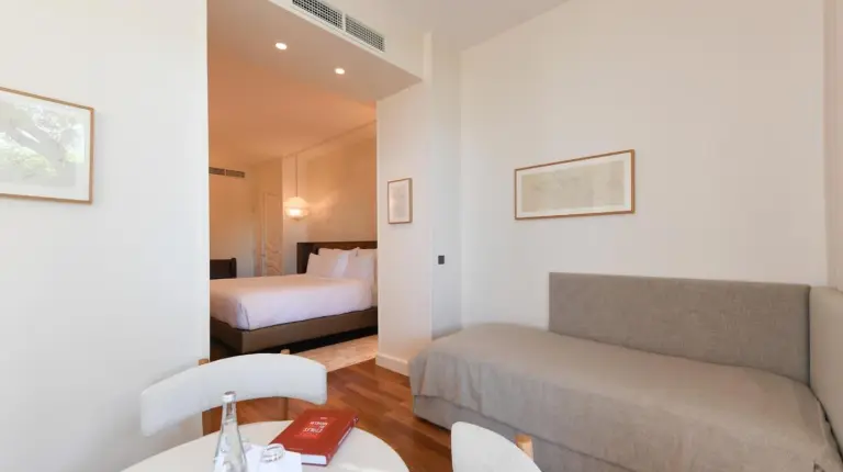 a living room with a couch and a bed at Le Petit Nice - Passedat in Marseille