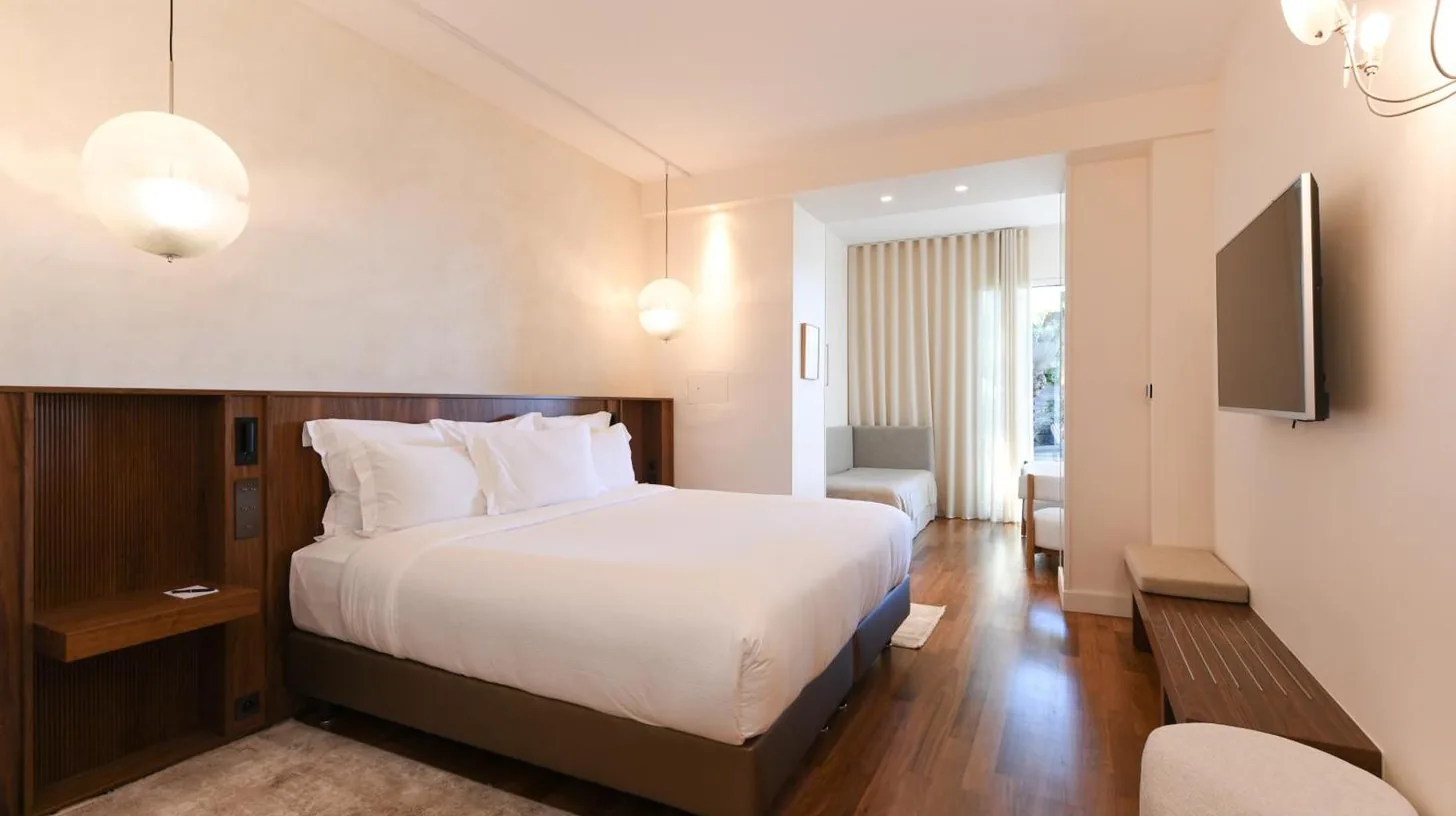 a hotel room with a bed and a television at Le Petit Nice - Passedat in Marseille