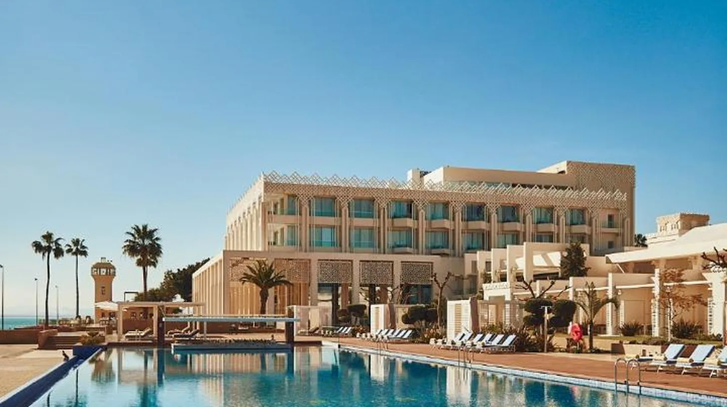 a large swimming pool in front of a building at Marchica Lagoon Resort in Nador