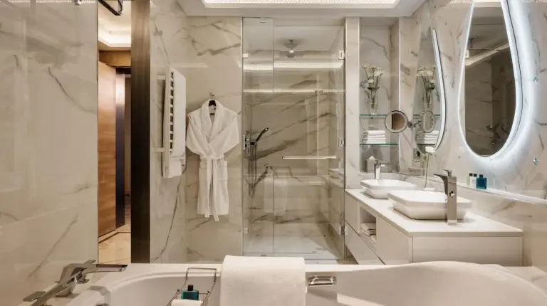 a bathroom with a tub and a sink and a shower at Marchica Lagoon Resort in Nador