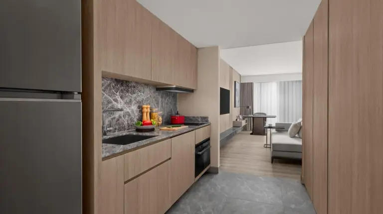 a hotel room with a bed and a couch at Marriott Executive Apartments