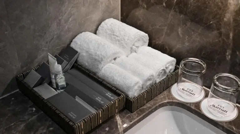 a bathroom with a sink and a mirror at Marriott Executive Apartments