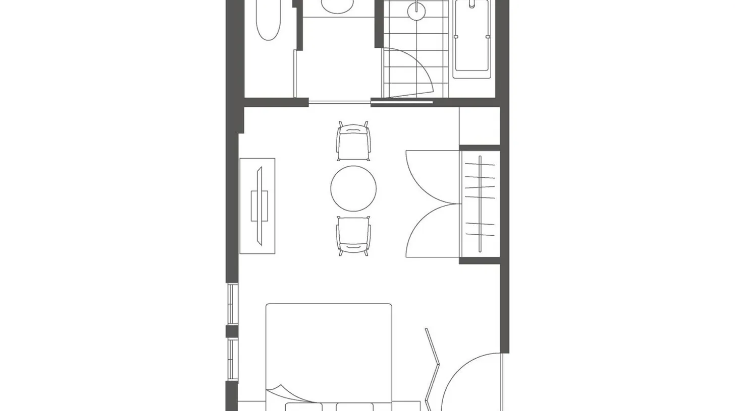 a bedroom with a large bed and a living room at Marufukuro in Kyoto