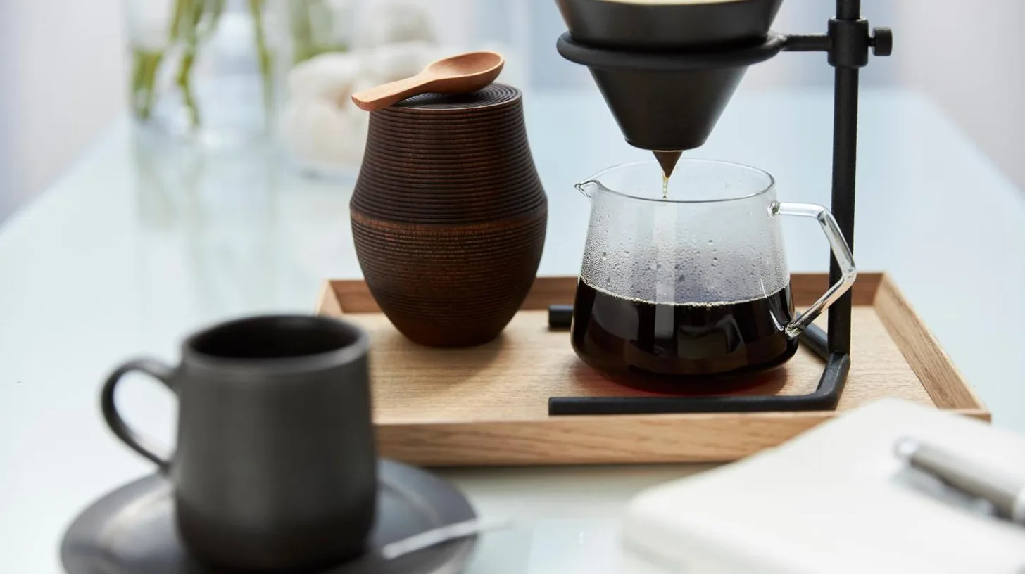 a coffee maker and two cups on a table at MOGANA in Kyoto