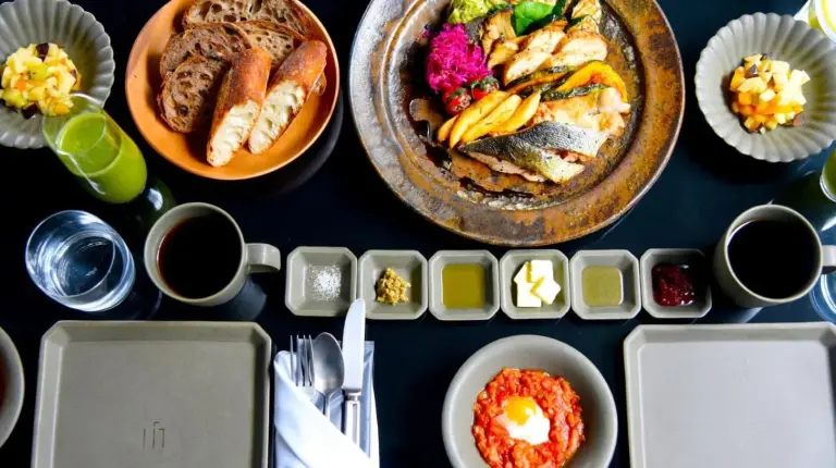 a table with plates of food and bowls of food at MOGANA in Kyoto