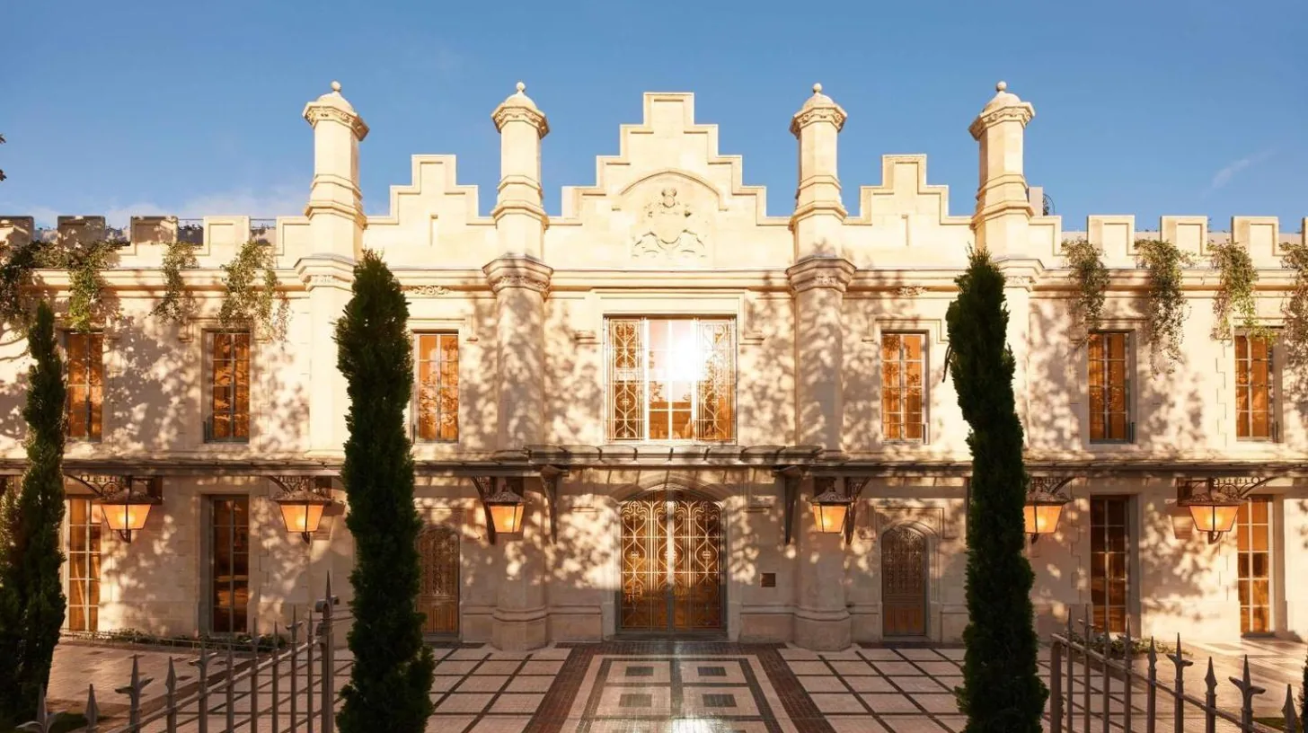 a large building with trees in front of it at Mondrian Bordeaux Les Carmes in Bordeaux