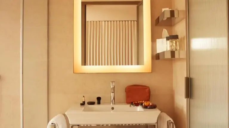 a bathroom with a sink and a mirror at Mondrian Bordeaux Les Carmes in Bordeaux