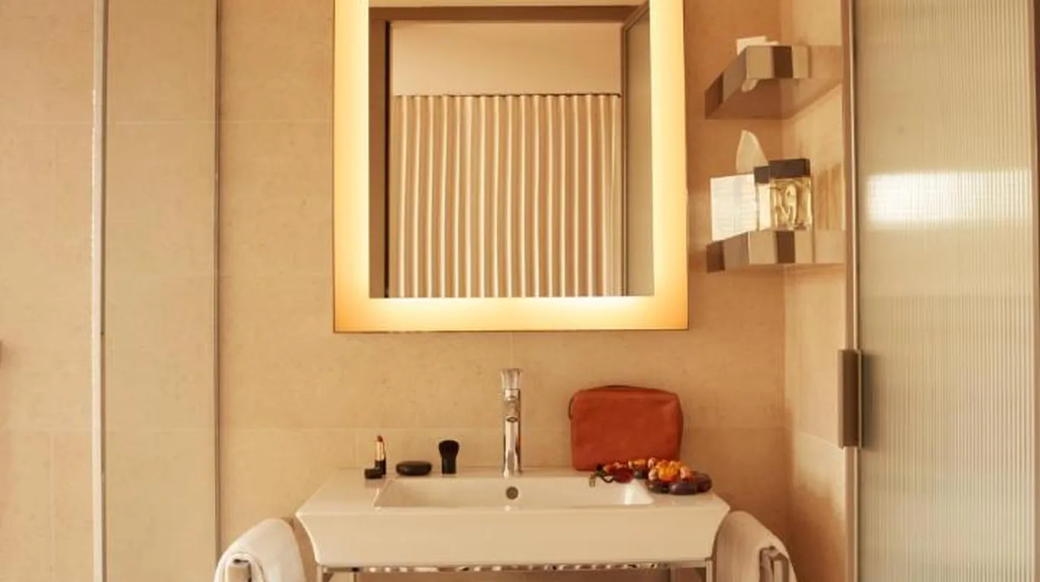 a bathroom with a sink and a mirror at Mondrian Bordeaux Les Carmes in Bordeaux