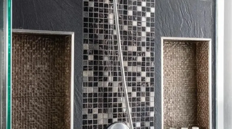 a shower with a shower head in a bathroom at Montraj Continent Sukhumvit Bangkok in Bangkok
