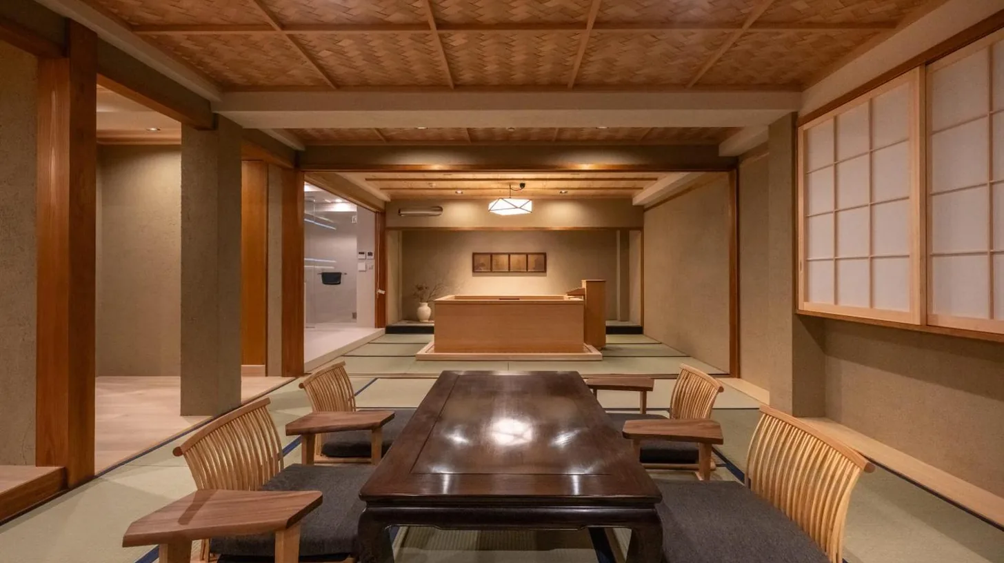 a conference room with a long table and chairs at Nazuna Kyoto Nishi Honganji in Kyoto