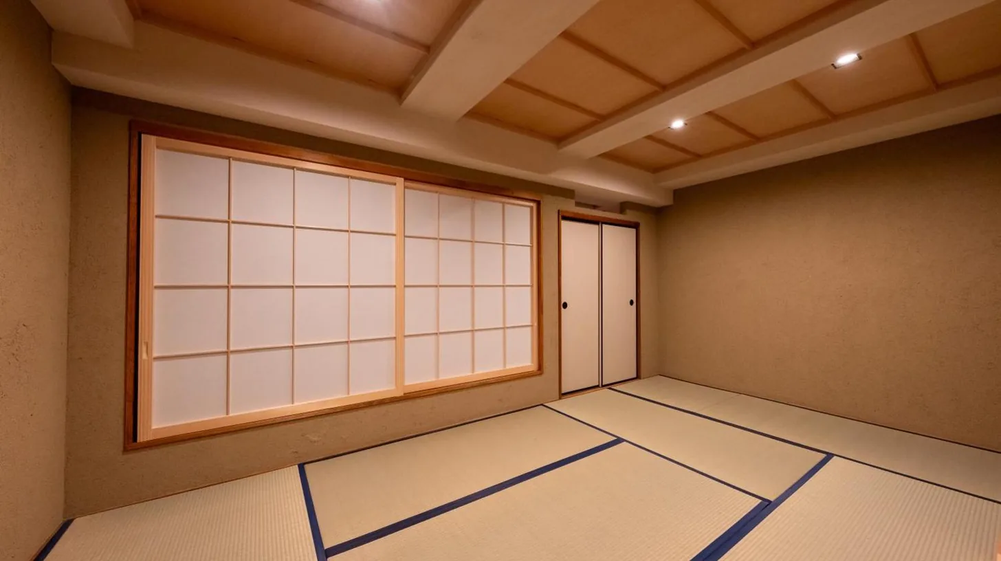 an empty room with a large window and a door at Nazuna Kyoto Nishi Honganji in Kyoto
