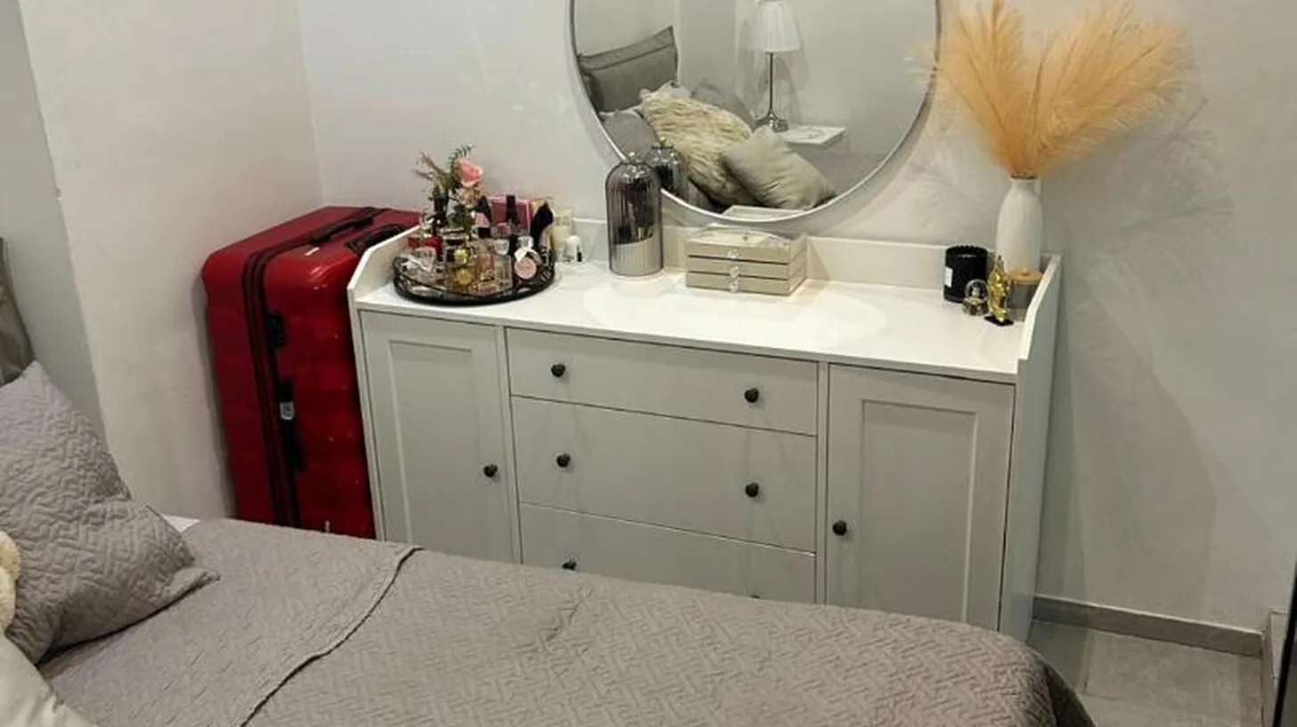 a bedroom with a bed with a mirror and a red suitcase at New central nice sea down town in Nice