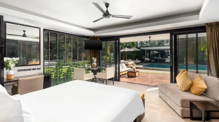 a bedroom with a bed and a swimming pool at Nikki Beach Resort & Spa Koh Samui in Lipa Noi
