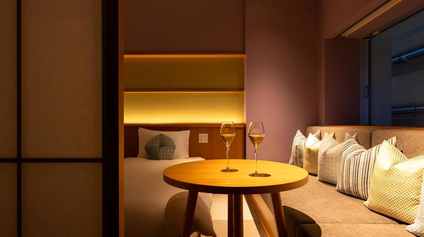 a bathroom with a tub and a toilet at OMO7 Osaka by Hoshino Resorts in Osaka