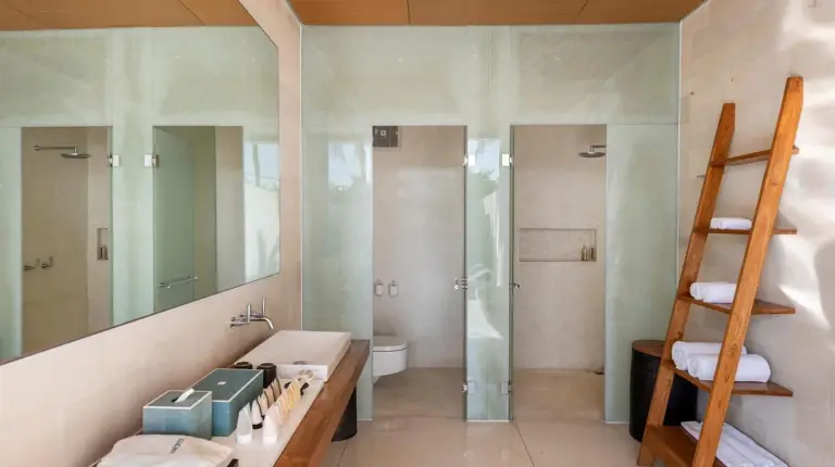 a bathroom with a sink and a shower and a ladder at One Eleven Retreat in Seminyak