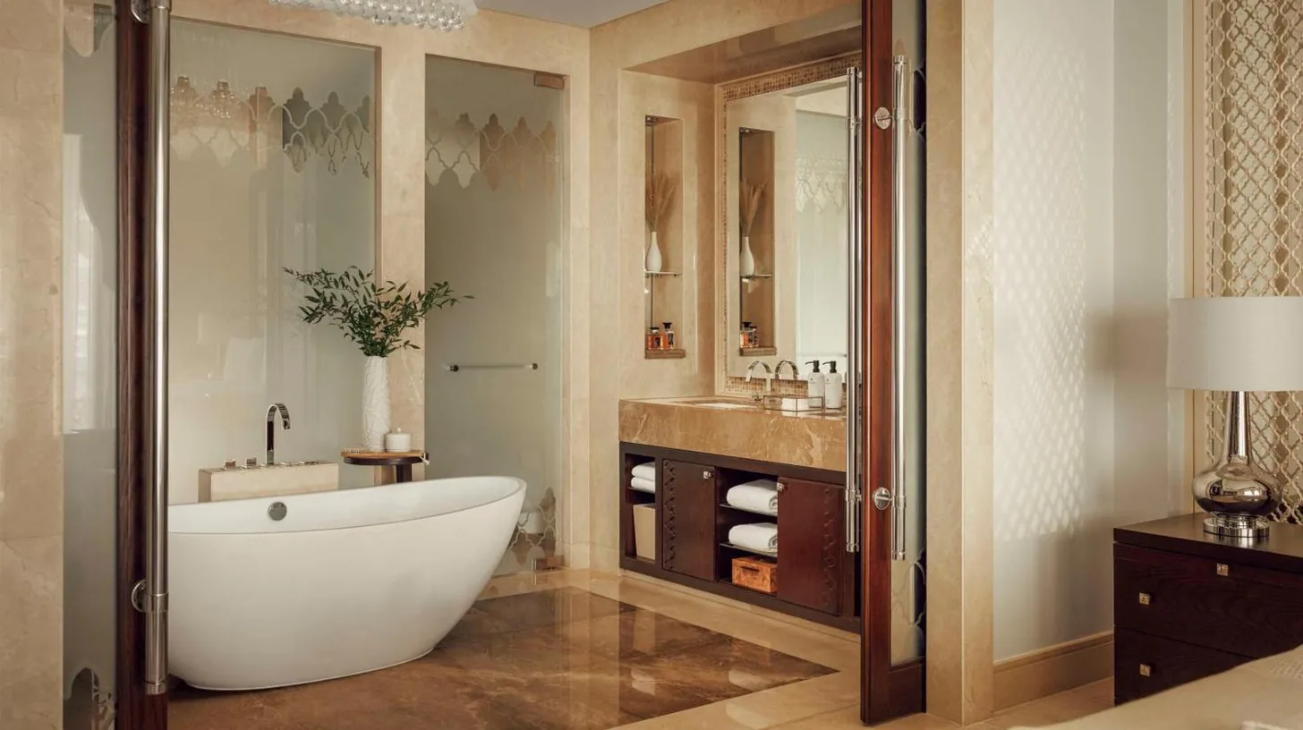a bathroom with a large tub and a sink at One&Only The Palm Dubai in Dubai