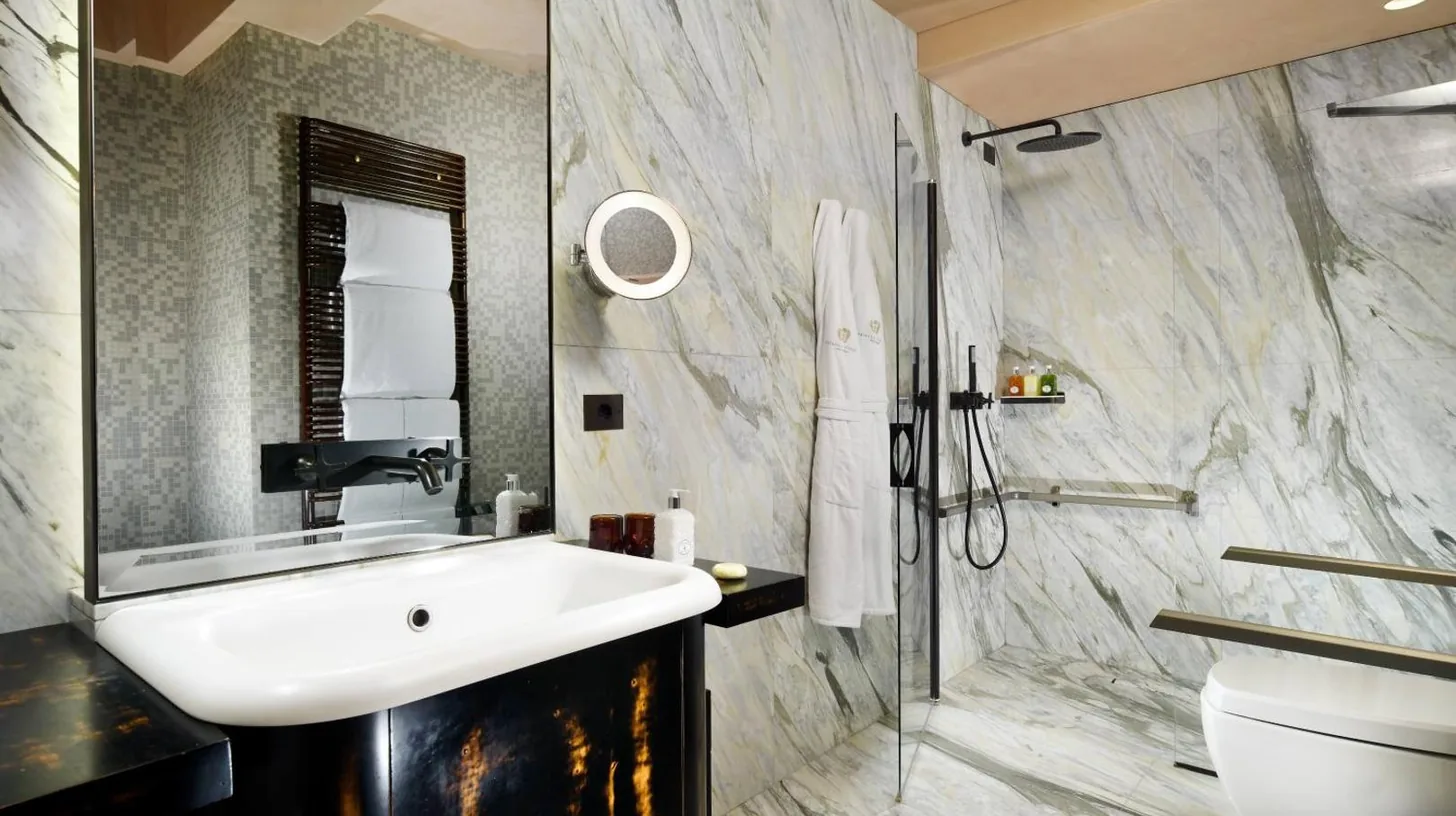 a bathroom with a sink and a toilet at Palazzo Venart Luxury Hotel in Venice