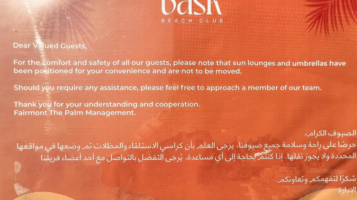 a flyer for a beach club with a banner at Palm Jumeirah Beach Paradise at Fairmont Residence in Dubai