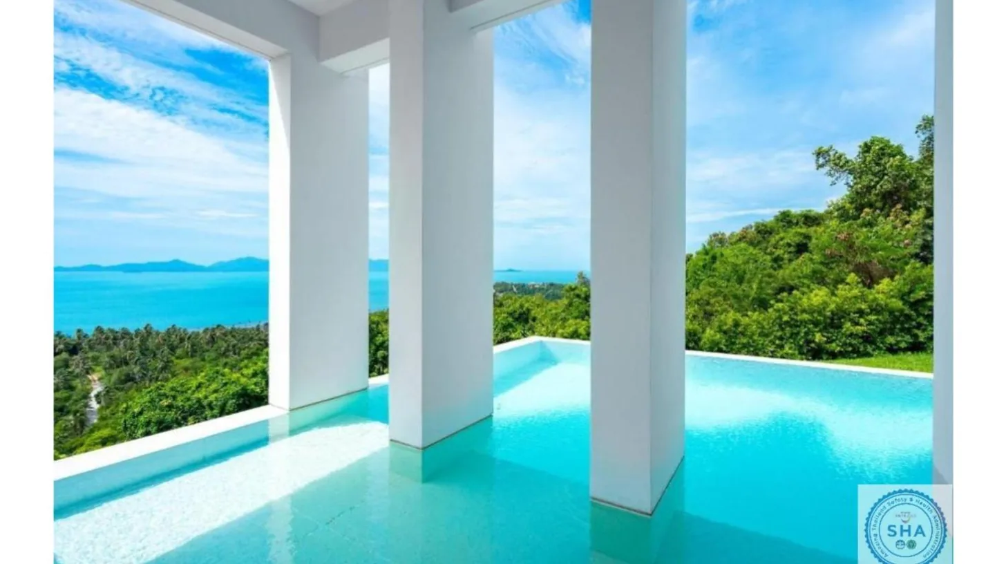 a room with a view of the ocean at Panorama Samui Residences in Ban Bang Po