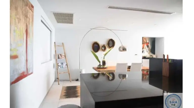 a living room with a desk in a room at Panorama Samui Residences in Ban Bang Po