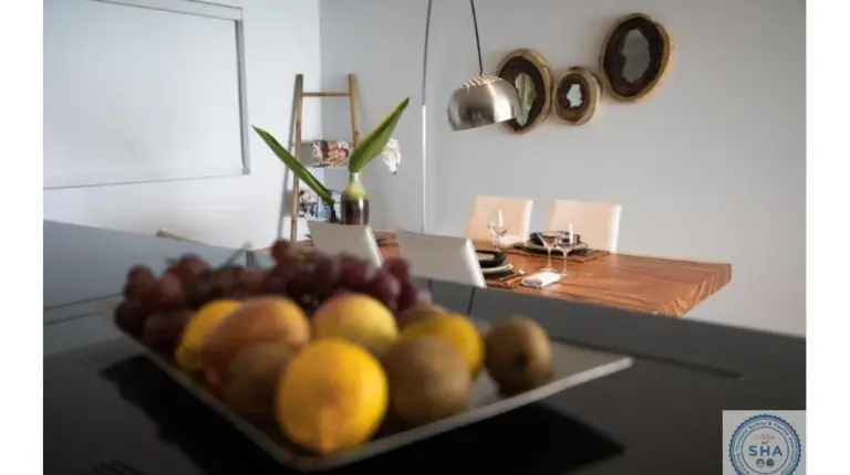 a bowl of fruit on a table in a kitchen at Panorama Samui Residences in Ban Bang Po