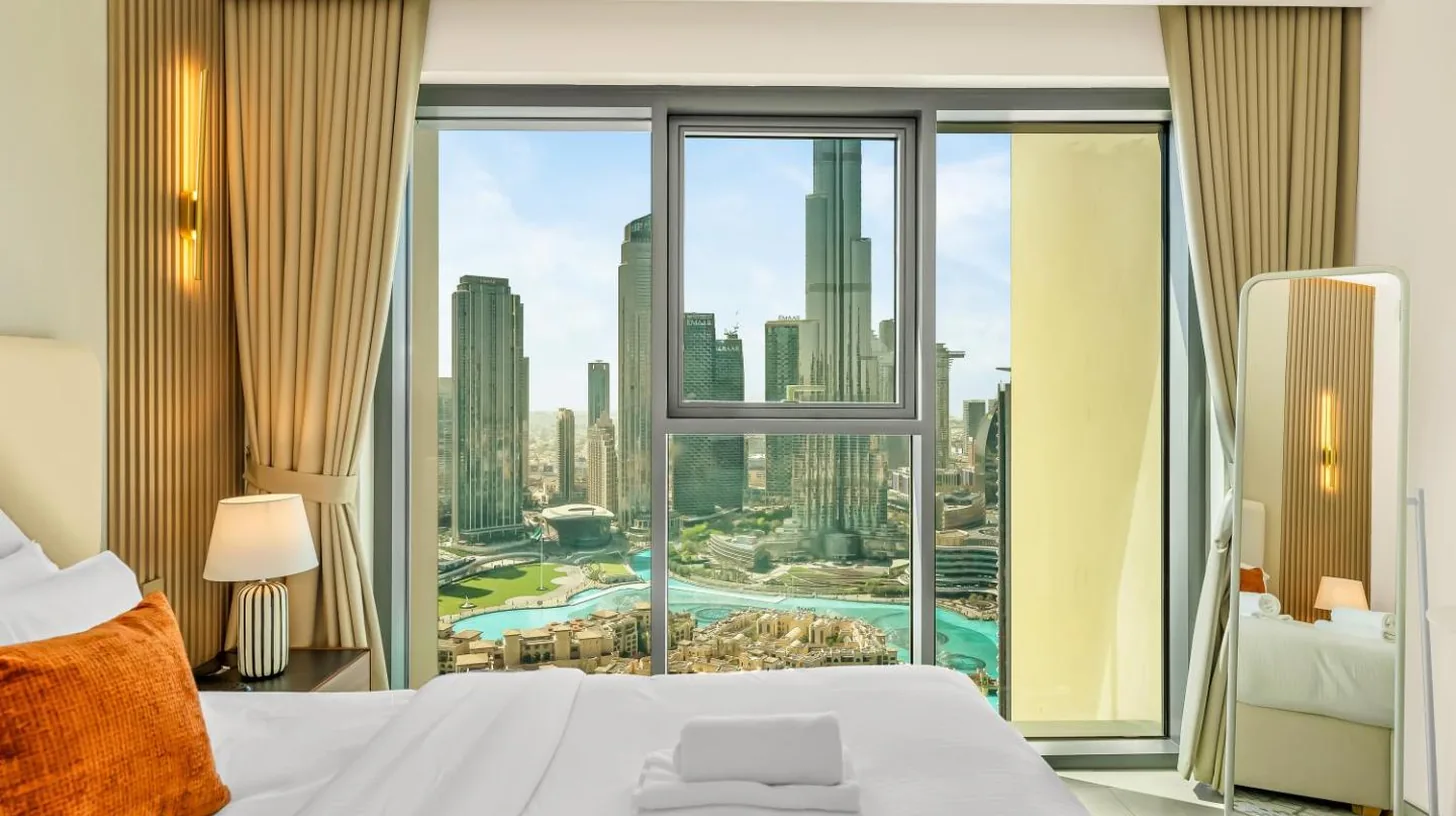 a living room with a couch and a table at Panoramic Burj Khalifa Views at Burj Royale by Propigo in Dubai