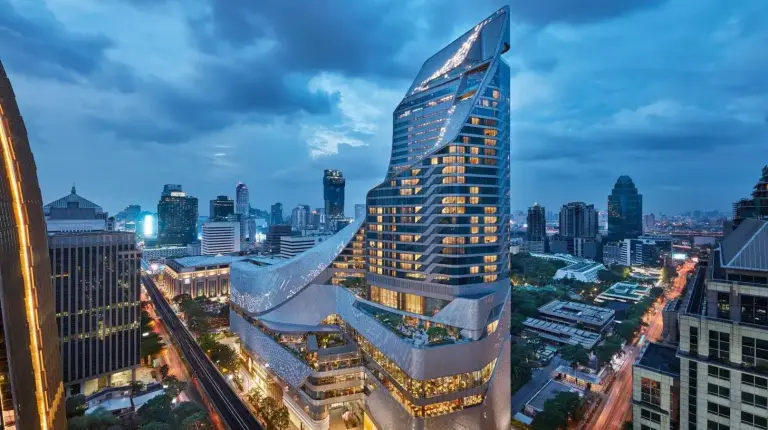 a view of a building in a city at night at Park Hyatt Bangkok in Bangkok