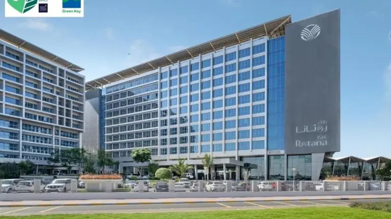 a rendering of a large building with cars parked outside at Park Rotana Abu Dhabi in Abu Dhabi