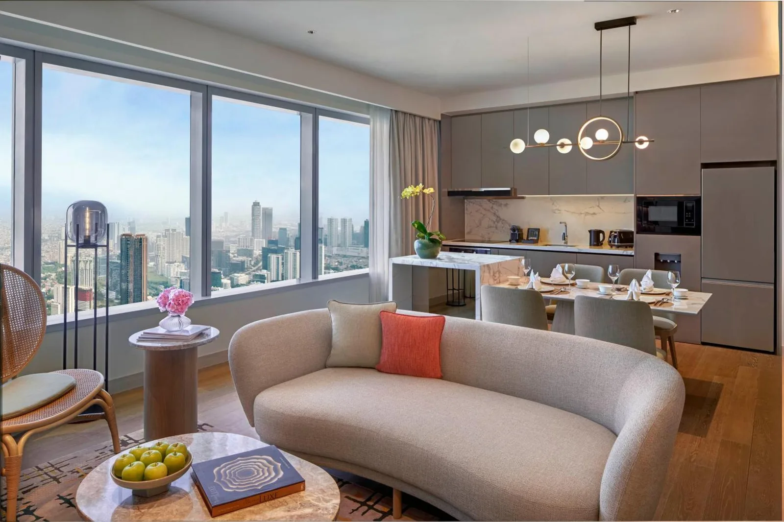 Executive Suite at PARKROYAL Serviced Suites Jakarta, showcasing a modern living space with city views